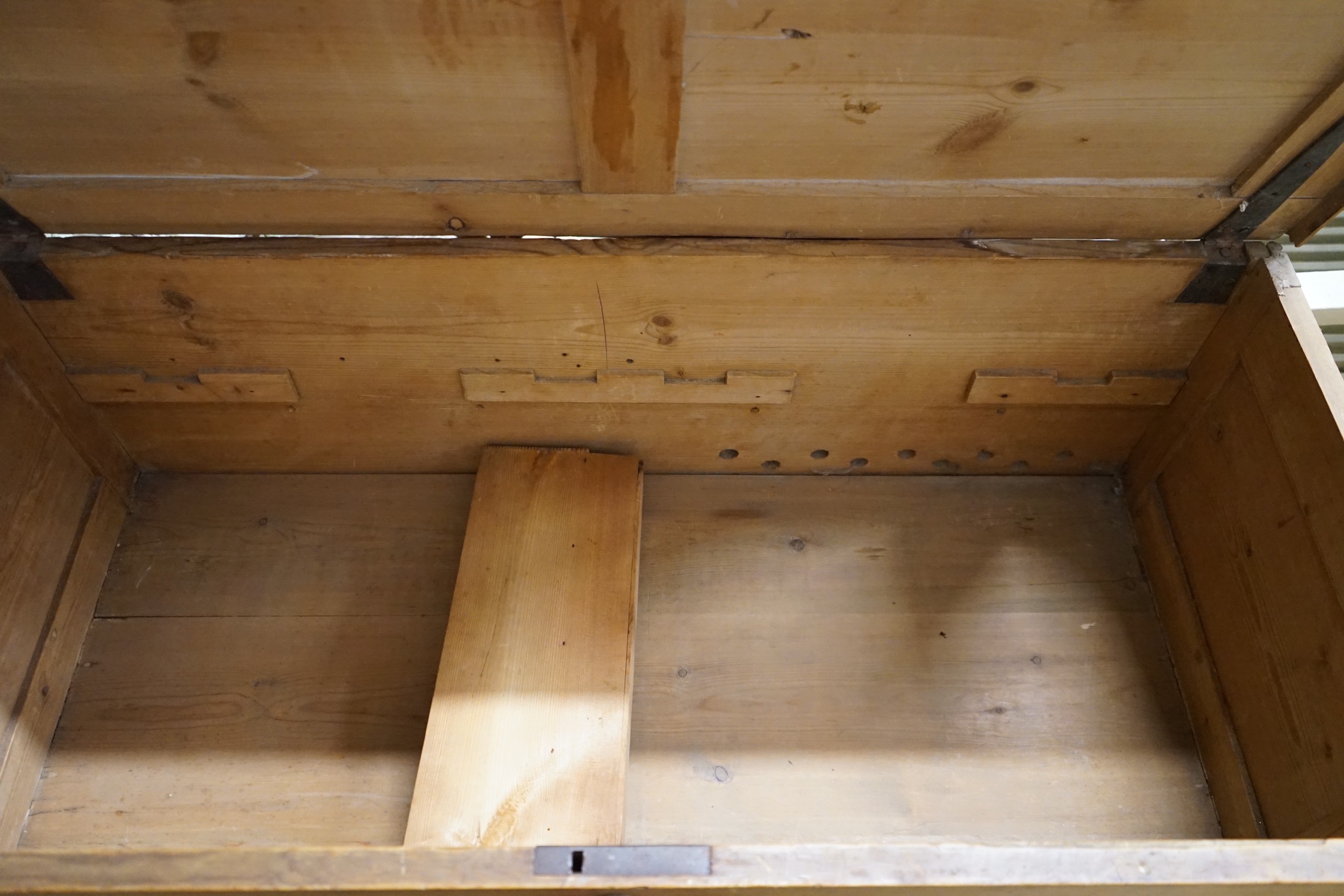 An 18th century panelled pine mule chest, width 118cm, depth 56cm, height 78cm